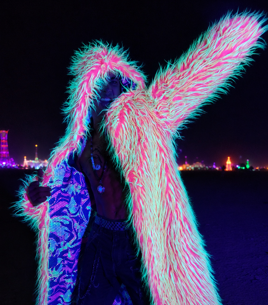 Neon Trip UV reactive fur coat glowing under blacklight, mens Burning Man rave outfit and festival clothing
