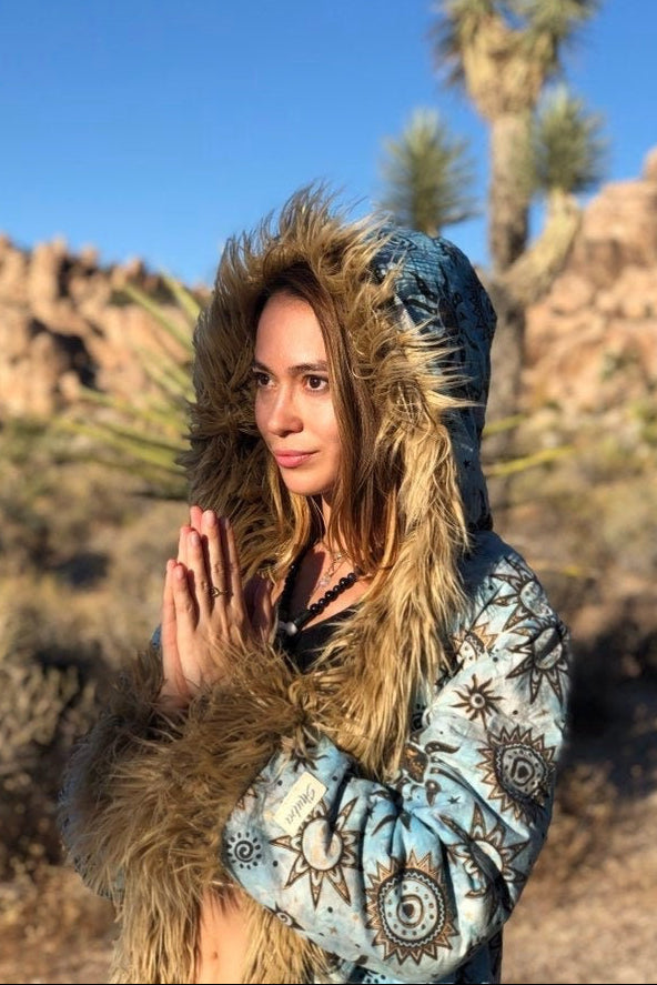 Blue patterned festival coat for women, reversible Burning Man jacket with tan faux fur trim, front view