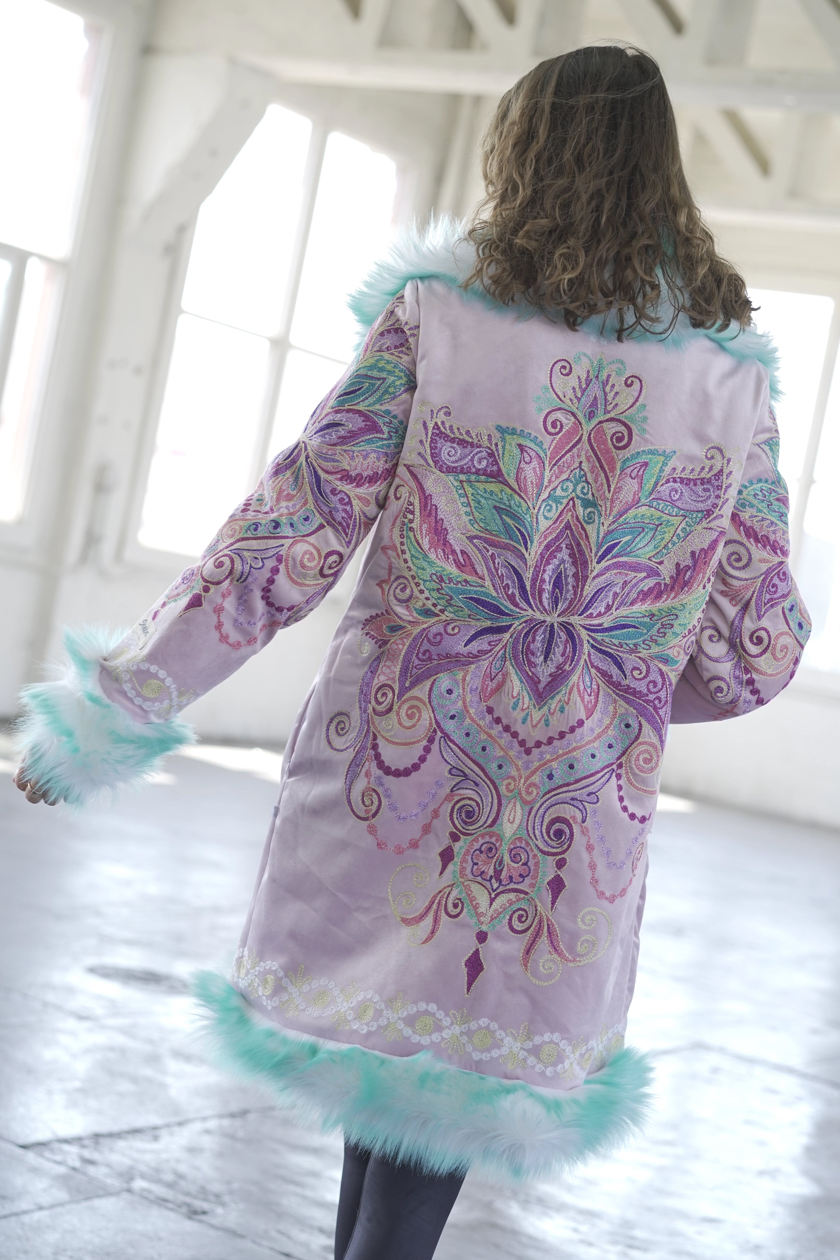 Purple Flower mandala embroidery festival coat shown from the back with mint faux fur trim