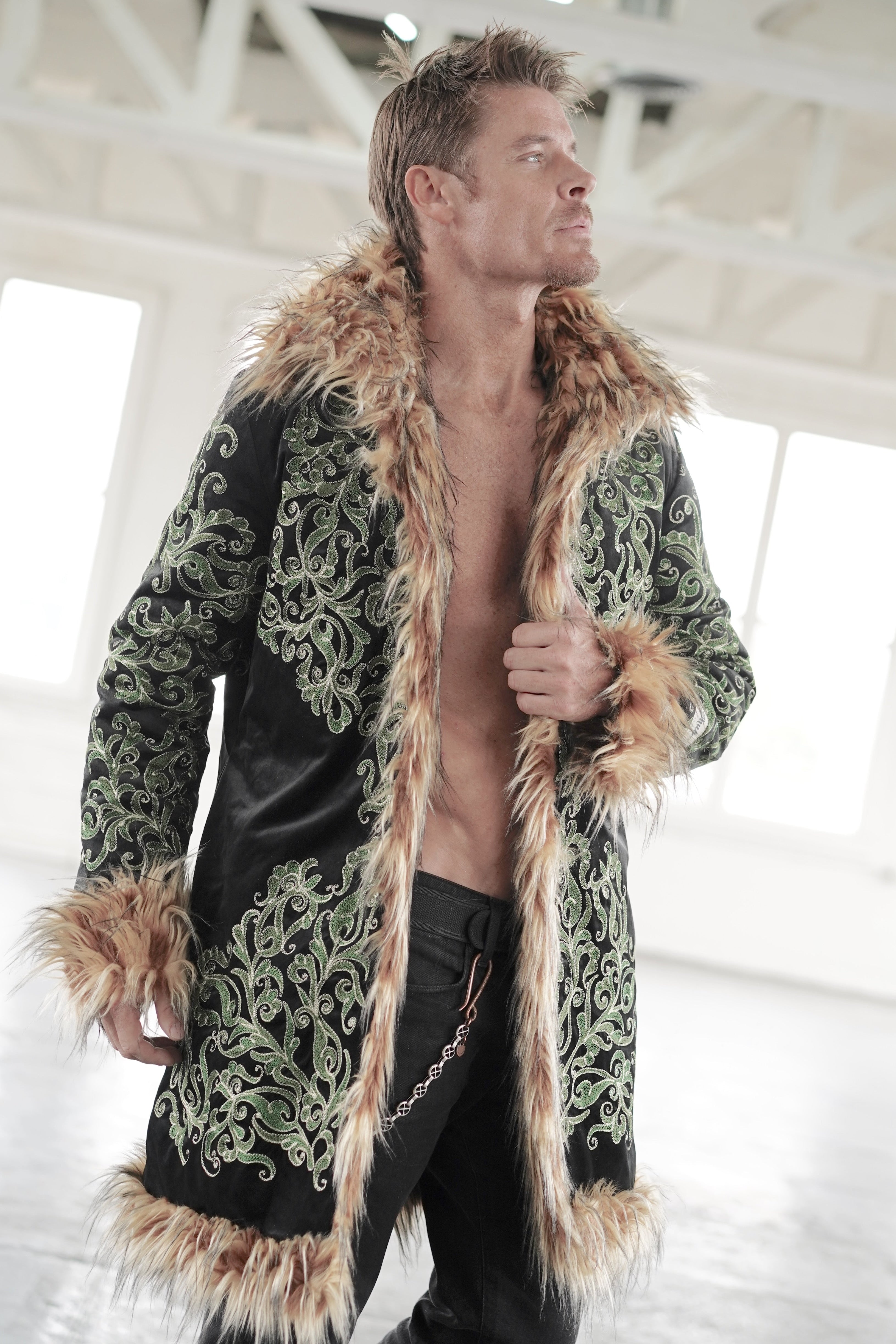 Black embroidered Burning Man coat with Tree of Life motif and textured brown faux fur trim