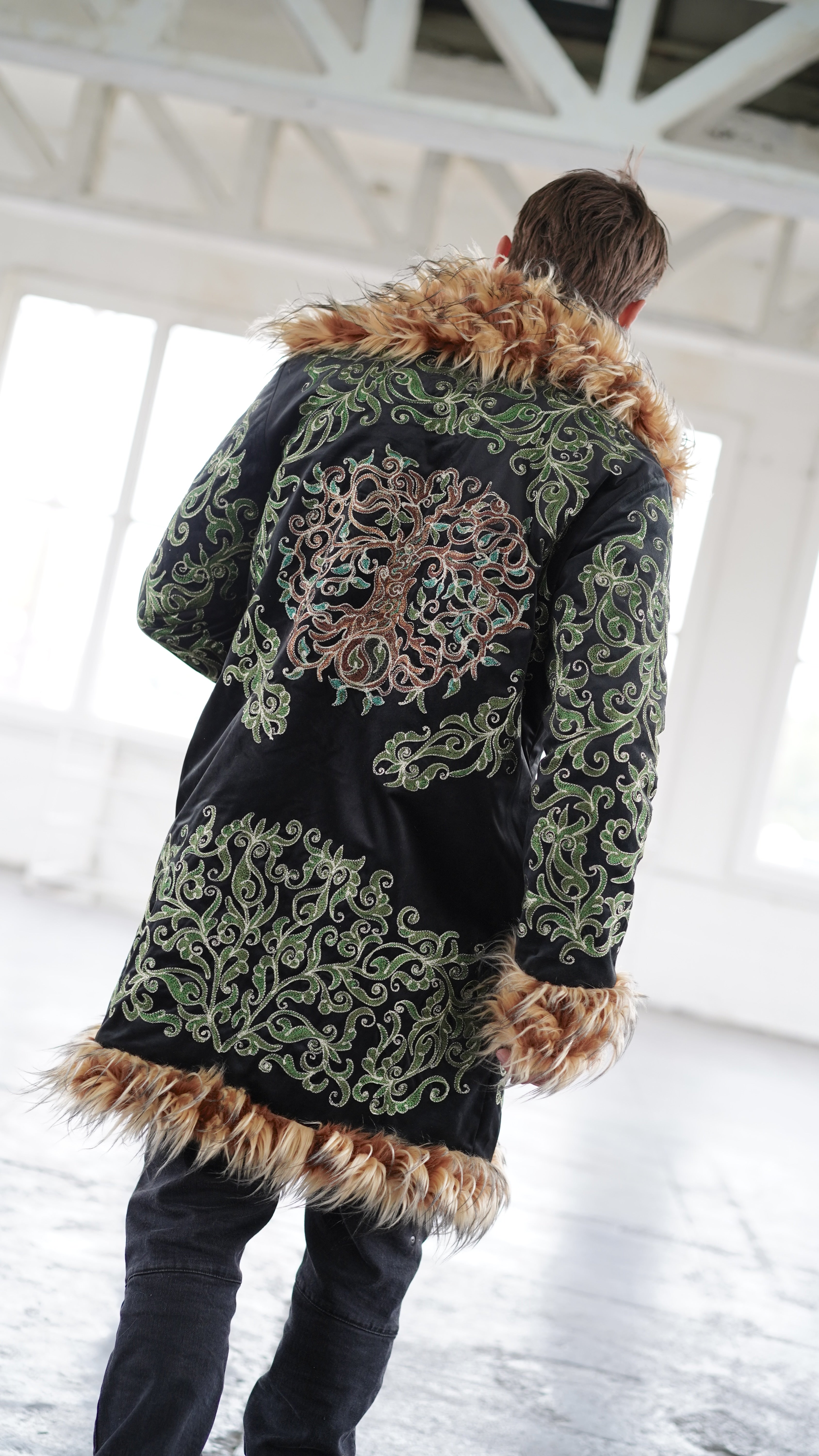 Back view of Tree of Life embroidery on black reversible faux fur festival Shuba Designs coat