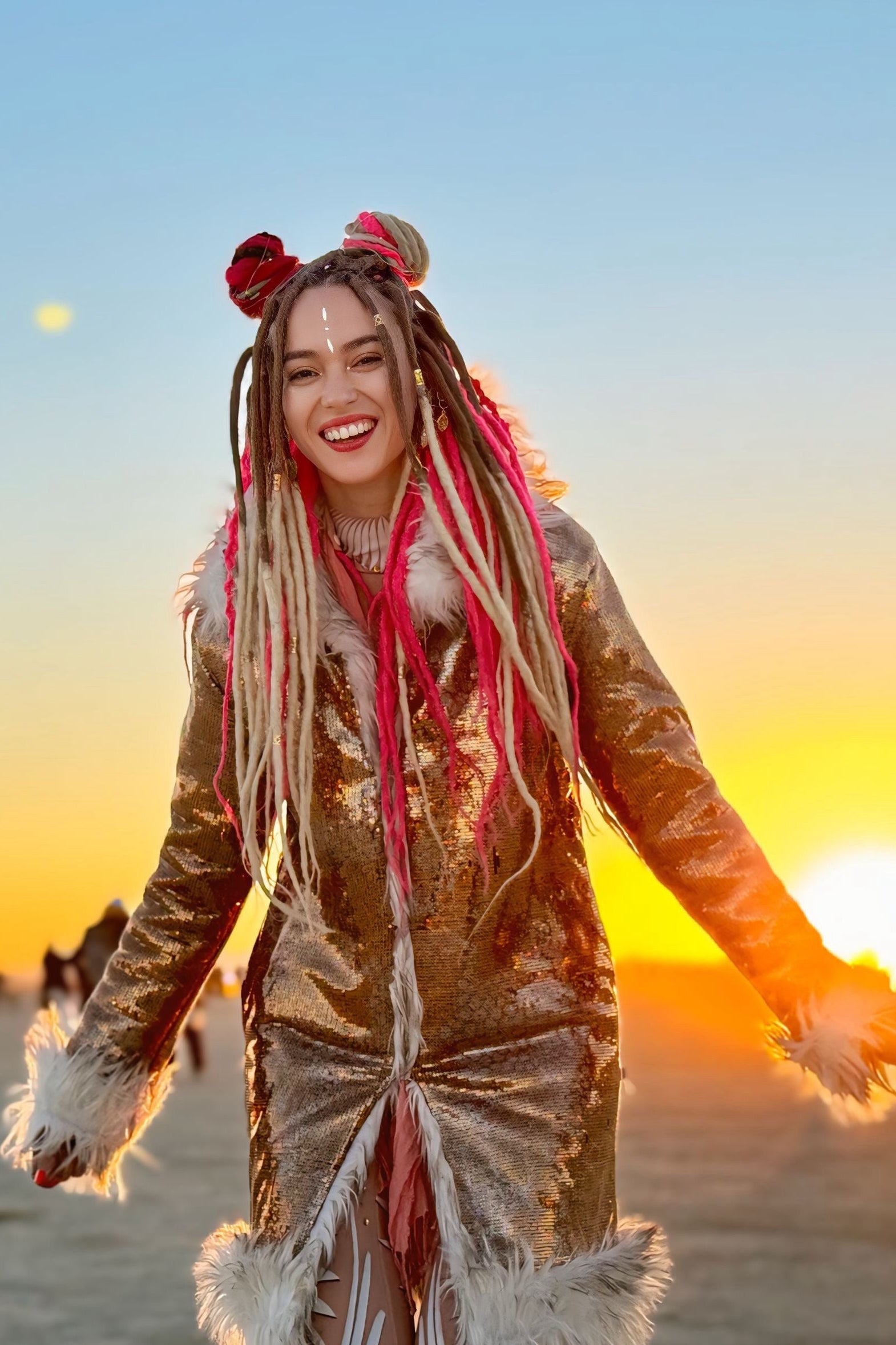 Iridescent  Burning Man festival outfit for women, reflective playa coat with white faux fur trim at desert sunset
