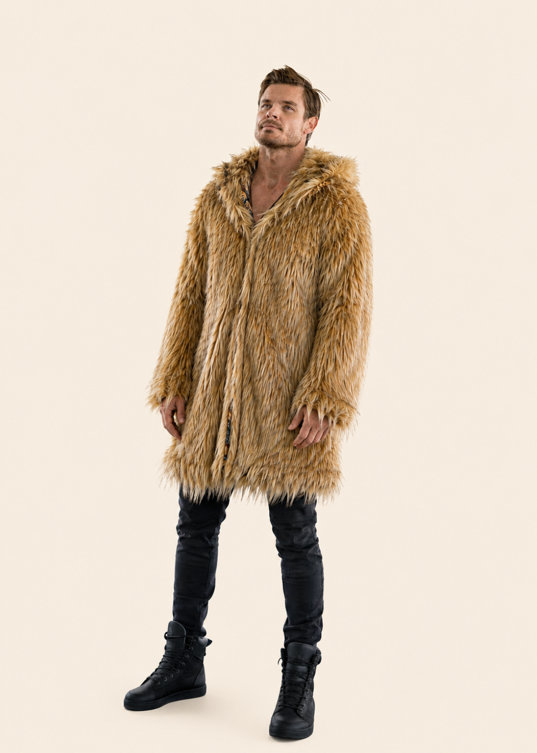 Man wearing a fur coat and black boots on a beige background